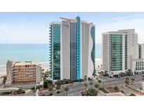An oceanside condo features blue and gray modern construction and ocean views in this attractive listing photo at 107 S Ocean Blvd. # 1201, Myrtle Beach, SC 29577