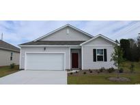 Charming single-Gathering home with a well-manicured lawn, attached garage, and a classic red front door at 1439 Nokota Dr., Conway, SC 29526