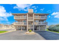 Inviting multi-story beach condo with covered parking and private balconies offering stunning ocean views at 1801 N Ocean Blvd. # A4, North Myrtle Beach, SC 29582