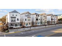 Charming coastal townhomes featuring modern design, neutral palettes, and inviting outdoor seating areas at 201-F Madison Ct., Myrtle Beach, SC 29577