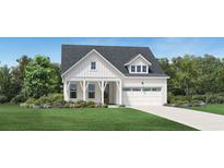 Charming two-story home featuring a welcoming front porch and attached two car garage at 6709 Genesis Dr, Murrells Inlet, SC 29576