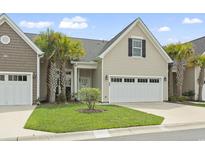 Charming single-Gathering home with a two-car garage, well-maintained lawn, and stately palm trees at 800 Monarch Dr. # 46, Myrtle Beach, SC 29588