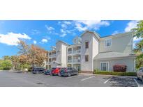 Attractive multi-story condominium building with ample parking and well-maintained landscaping at 1033 World Tour Blvd. # 203, Myrtle Beach, SC 29579