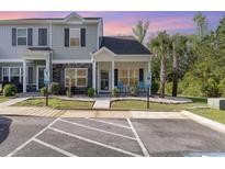 Charming two-story townhome featuring stone accents, covered entry, and accessible parking at 1105 Dinger Ct. # 1105, Myrtle Beach, SC 29588