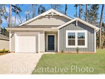 Charming single-story home with a one-car garage, well-maintained lawn, and inviting front entrance at 1106 Cherrystone Loop, Conway, SC 29526