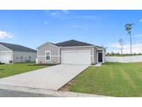 Charming single-story home featuring a well-maintained lawn and a two-car garage, offering a welcoming curb appeal at 181 Saddle St, Conway, SC 29527