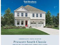 Charming two-story home with landscaped yard and a classic architectural style, offering a welcoming curb appeal at 6775 Genesis Dr, Murrells Inlet, SC 29576