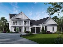 Charming two-story home boasting a welcoming front porch, attached garage, and professionally landscaped yard at 1099 Wachesaw Rd., Murrells Inlet, SC 29576