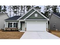 Charming single-story home featuring a two-car garage and stone veneer accents at 1226 Nw Calabash Station Blvd., Calabash, NC 28467