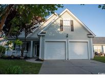 Charming two-story home featuring a two-car garage and a welcoming front porch at 2039 Chadbury Ln., Myrtle Beach, SC 29588