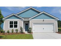 Charming home with blue and gray siding, a front-facing garage, and a well-manicured lawn at 377 Rookroost Circle, Conway, SC 29526