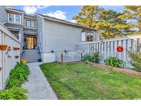 Cozy townhouse backyard with a small lawn and decorative fence, creating a charming outdoor space at 4006 Fairway Lakes Dr. # 4006, Myrtle Beach, SC 29577