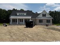 Attractive one-story home featuring gray brick and a gabled roof, creating a charming and inviting curb appeal at 4268 Long Avenue Ext., Conway, SC 29526