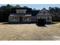 Front exterior of home under construction featuring windows and a dormer at 4268 Long Avenue Ext., Conway, SC 29526