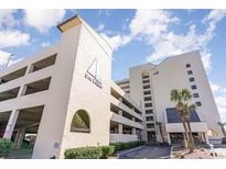 Exterior of Sea Pointe building showcasing the facade, covered parking, and inviting entrance at 6100 N Ocean Blvd. # 804, North Myrtle Beach, SC 29582