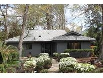 Charming single-story home with mature trees, a well-kept lawn, and beautiful shrubs at 880 Briarwood Dr., Myrtle Beach, SC 29572