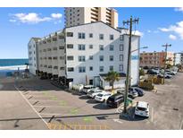 Coastal building with parking lot near the beach and ocean views at 920 N Waccamaw Dr. # 2-304, Murrells Inlet, SC 29576