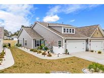 Charming home with a two-car garage, landscaped yard, and beautiful curb appeal at 328 Logan St., Little River, SC 29566
