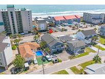Aerial view showcasing a home with a private pool near the ocean at 4504 S Ocean Blvd. # A, North Myrtle Beach, SC 29582