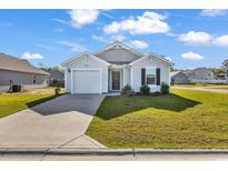 Charming single-story home with a well-maintained lawn and an attached one car garage at 500 Dundalk Dr., Conway, SC 29526