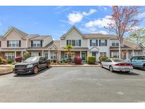 Inviting townhome features charming details, well-manicured landscaping, and convenient parking at 1046 Palisade Circle # 1046, Myrtle Beach, SC 29577