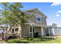 Charming two-story home with neutral siding, white trim, and a well-maintained lawn on a sunny day at 1411 Turkey Ridge Rd. # 30-B, Surfside Beach, SC 29575
