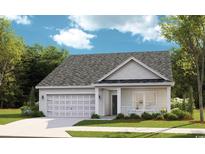 Charming one-story home featuring a covered porch, attached garage and manicured lawn and inviting curb appeal at 1525 Seachase Way, North Myrtle Beach, SC 29582