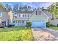 Charming two-story home with red shutters, a well-manicured lawn, and an attached two-car garage at 190 Hamilton Way, Conway, SC 29526