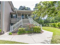 Charming condo with a quaint front porch, white railings, and beautiful landscaping at 227 Pinehurst Ln. # 6D, Pawleys Island, SC 29585