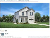 A charming two-story home featuring bright white siding, a covered front porch, and an attached garage at 2528 Hillbourne Loop, North Myrtle Beach, SC 29582