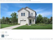 Charming two-story home with white siding, blue door, and a well-manicured lawn at 2612 Hillbourne Loop, North Myrtle Beach, SC 29582