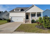 Charming single-Gathering home with a well-maintained front yard and attached garage at 512 Charlton Blvd., Georgetown, SC 29440