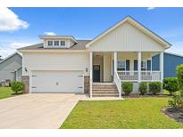Charming home with a covered porch, garage, and well-maintained lawn at 512 Charlton Blvd., Georgetown, SC 29440