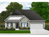 Charming one-story home featuring a front-facing garage and a beautifully manicured lawn with lush greenery at 1041 Jase Dr., Longs, SC 29568