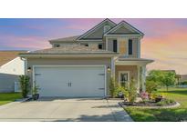Charming two-story home featuring a two-car garage, manicured lawn, and beautiful landscaping at 1313 Cascarilla Ct., Myrtle Beach, SC 29579