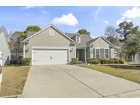 Charming single-story home with a two-car garage, well-maintained lawn, and inviting curb appeal at 3053 Chesterwood Ct., Myrtle Beach, SC 29579
