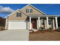 Charming single-Gathering home featuring a two-car garage and a covered front porch at 402 Acosta Circle, Conway, SC 29527