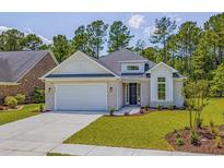 Charming single-story home with a brick facade, manicured lawn, and attached two-car garage at 4932 South Island Dr., North Myrtle Beach, SC 29582