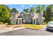 Inviting townhome featuring neutral siding, manicured lawn, and covered entryway at 503 20Th Ave. N # 19-C, North Myrtle Beach, SC 29582
