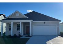 Charming single-story home featuring a two-car garage, well-maintained lawn, and craftsman-style design at 532 Duvall St., Longs, SC 29568