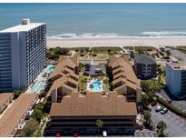 Expansive aerial view of a beachfront condo complex with pools and ocean views at 5507 N Ocean Blvd. # 105, Myrtle Beach, SC 29577