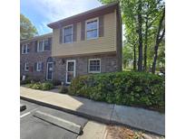 Charming two-story townhouse with a brick facade and well-maintained landscaping at 830 44Th Ave. N # B4, Myrtle Beach, SC 29577