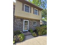 Charming home exterior featuring brick and siding, complemented by lush landscaping and a welcoming entrance at 830 44Th Ave. N # B4, Myrtle Beach, SC 29577