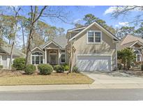 Charming two-story home with a two-car garage and well-maintained landscaping at 929 Tidewater Dr., North Myrtle Beach, SC 29582