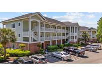 Attractive condo building featuring multiple floors, staircases and parking at 1514 Lanterns Rest Rd. # 304, Myrtle Beach, SC 29579