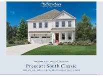 Charming two-story home with a landscaped yard, a two-car garage, and a welcoming red front door at 200 Black Water Dr., Murrells Inlet, SC 29576