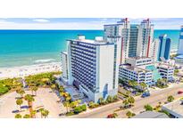Oceanfront resort featuring balconies, a swimming pool, palm trees, and convenient parking at 2001 S Ocean Blvd. # 210, Myrtle Beach, SC 29577