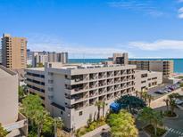 Expansive aerial view of the North Shore Oceanfront Hotel, showcasing its prime beach location and modern architectural design at 208 74Th Ave. N # 2517, Myrtle Beach, SC 29572
