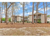 Inviting condo with screened porches surrounded by lush greenery and mature trees at 7207 Sweetwater Blvd. # 7207, Murrells Inlet, SC 29576