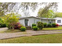 Charming one-story home with a well-maintained lawn, gravel drive, and inviting front entrance at 835 South Marlin Circle, Murrells Inlet, SC 29576